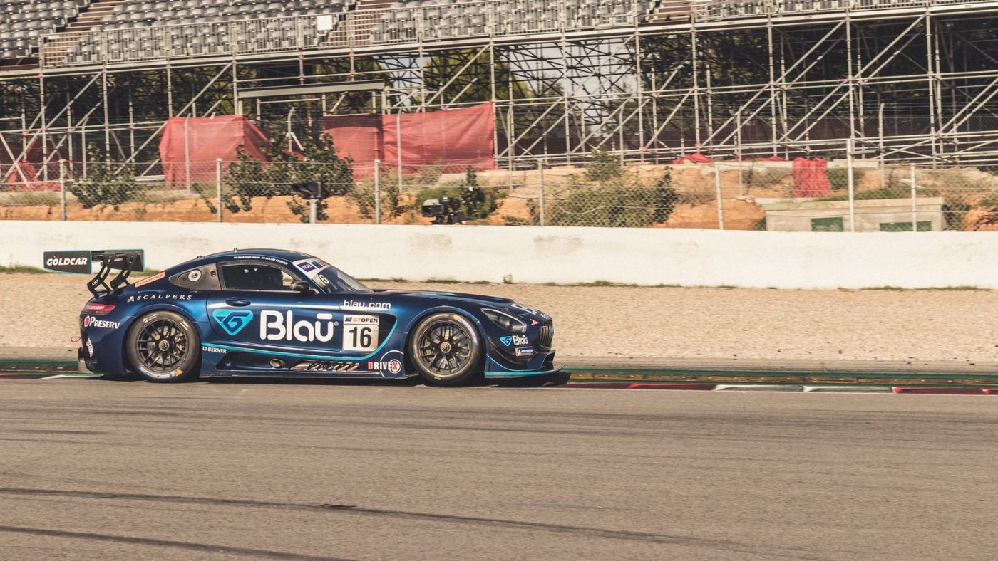 Blue Racing Car Speeds on a Track jigsaw puzzle