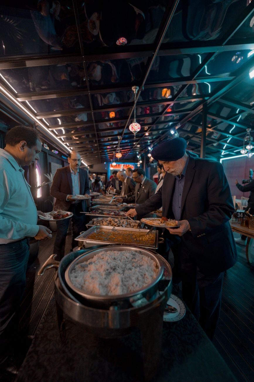 Men Enjoying a Grand Buffet Spread at jigsaw puzzle