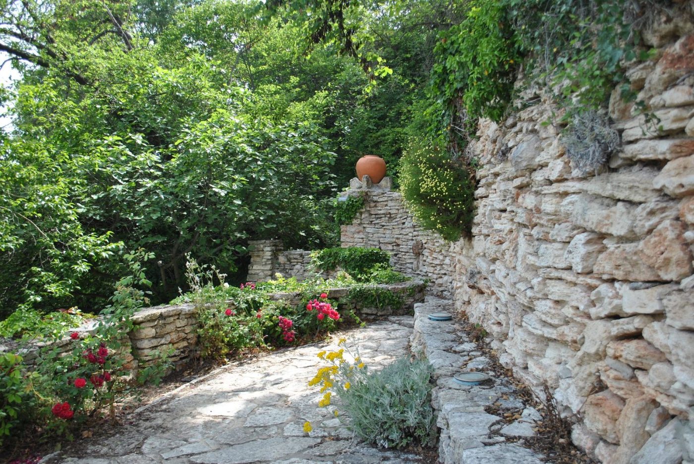 Charming Garden Path Flanked by Stone Walls jigsaw puzzle